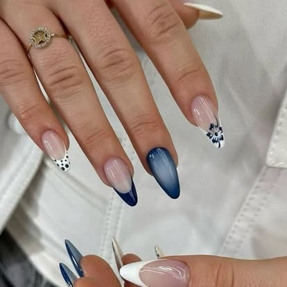 Blue ombre almond nails with floral accents