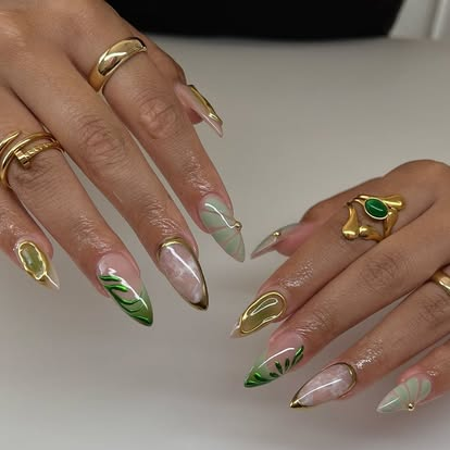 Nude almond nails with gold chrome and green swirl art